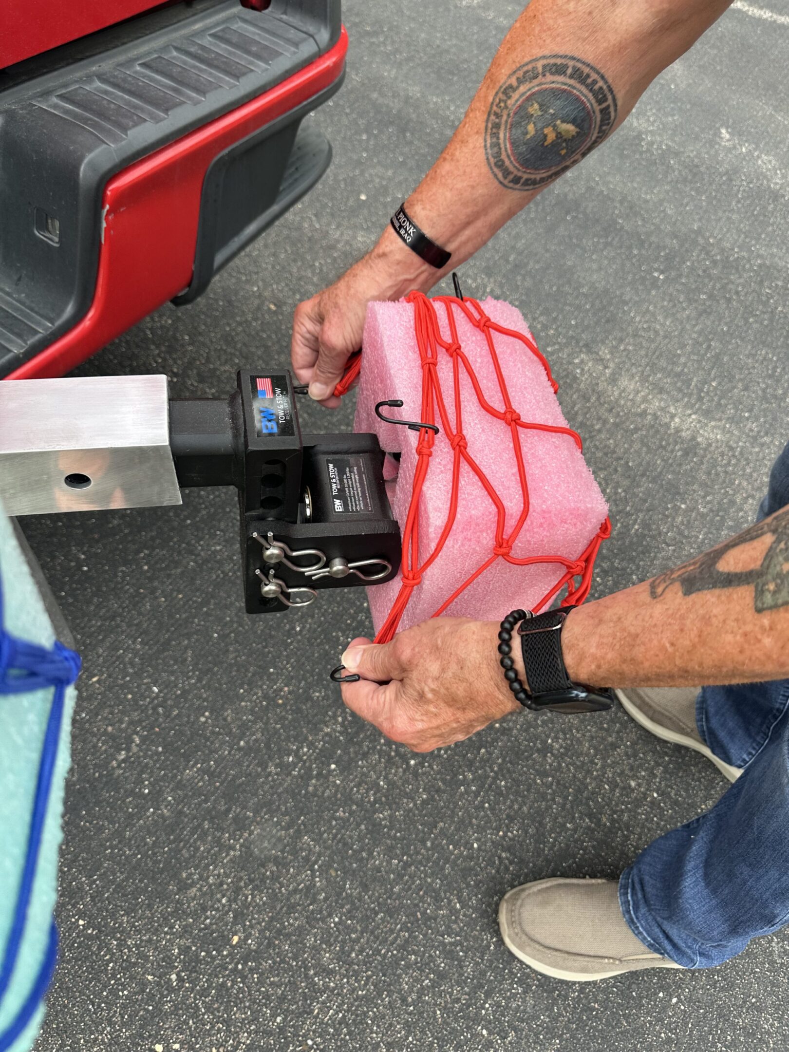 Person holding a wrapped gift near a drone.