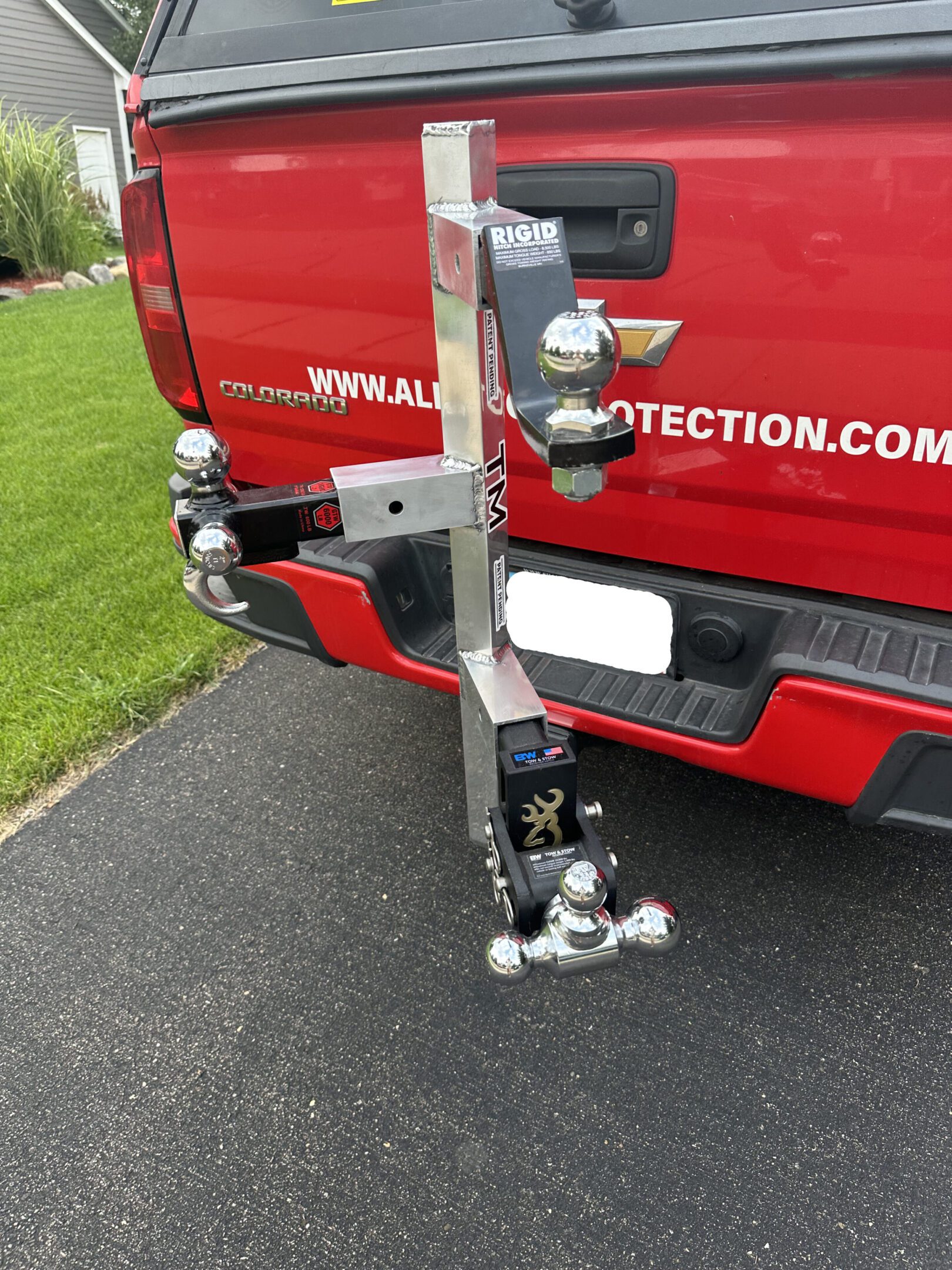 Close-up of a vehicle's trailer hitch with multiple connected components.