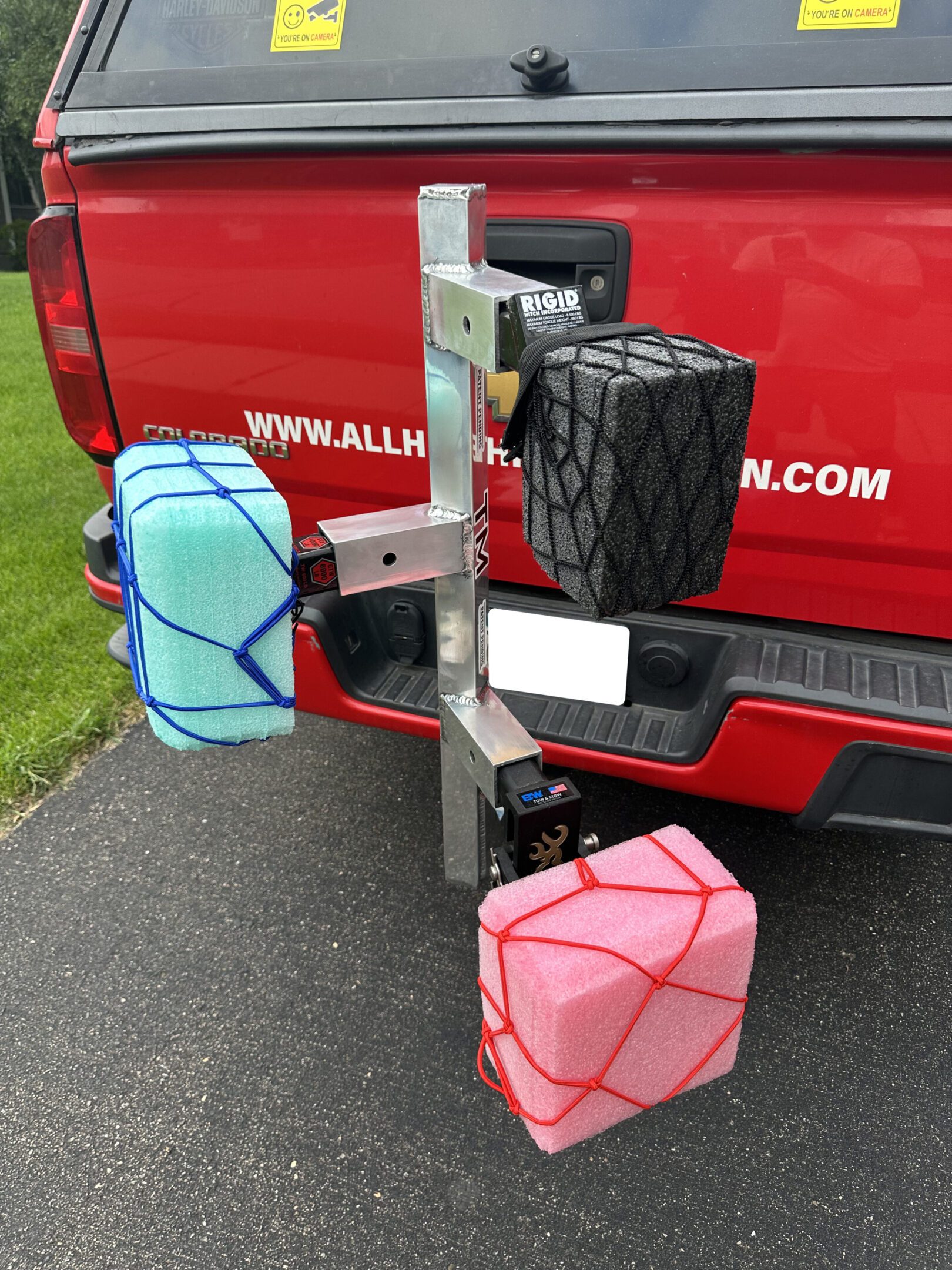 A vehicle-mounted carrier holding water containers and a black box.