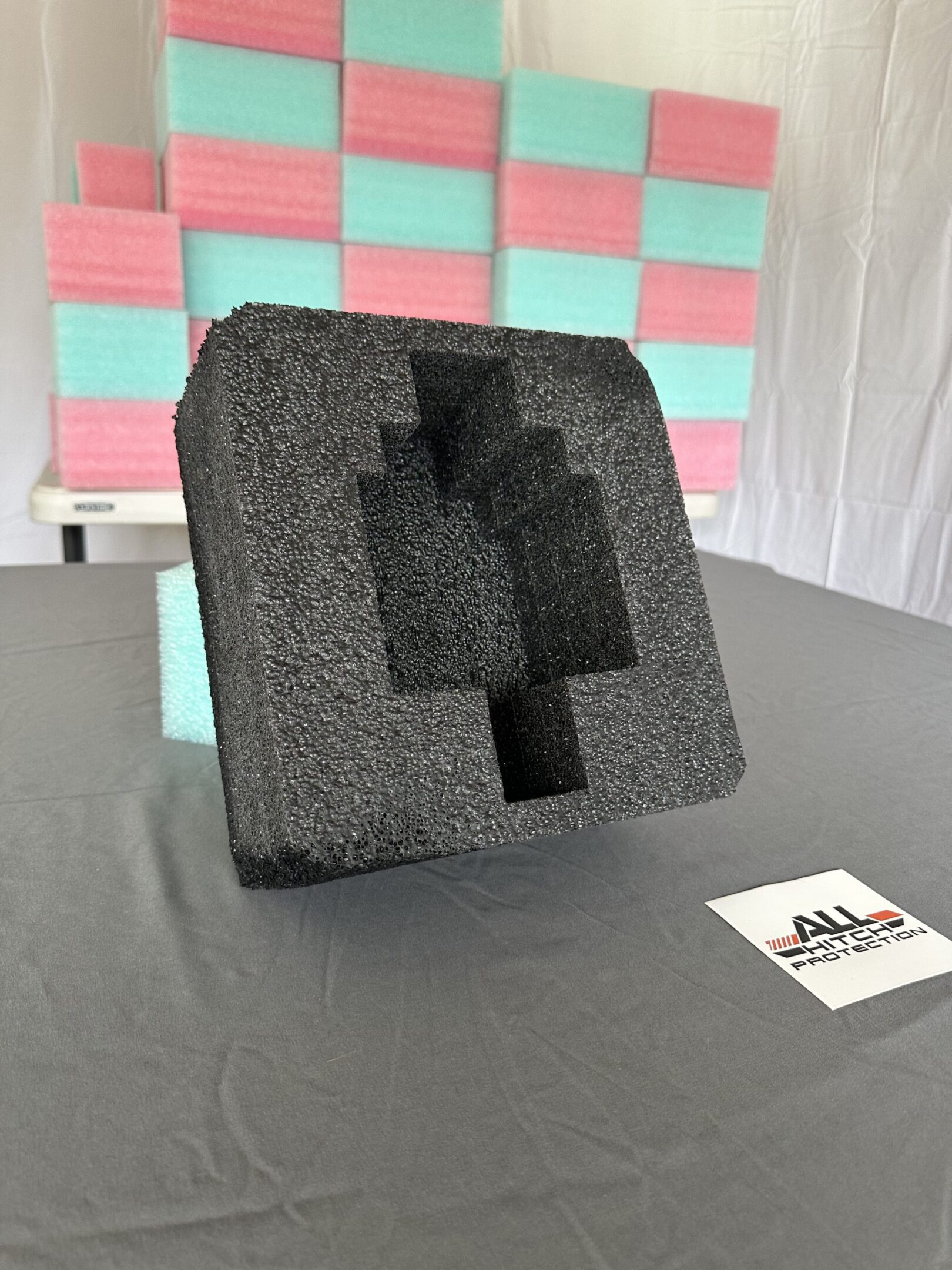 Black foam packaging with a pixelated Minecraft pickaxe cutout.