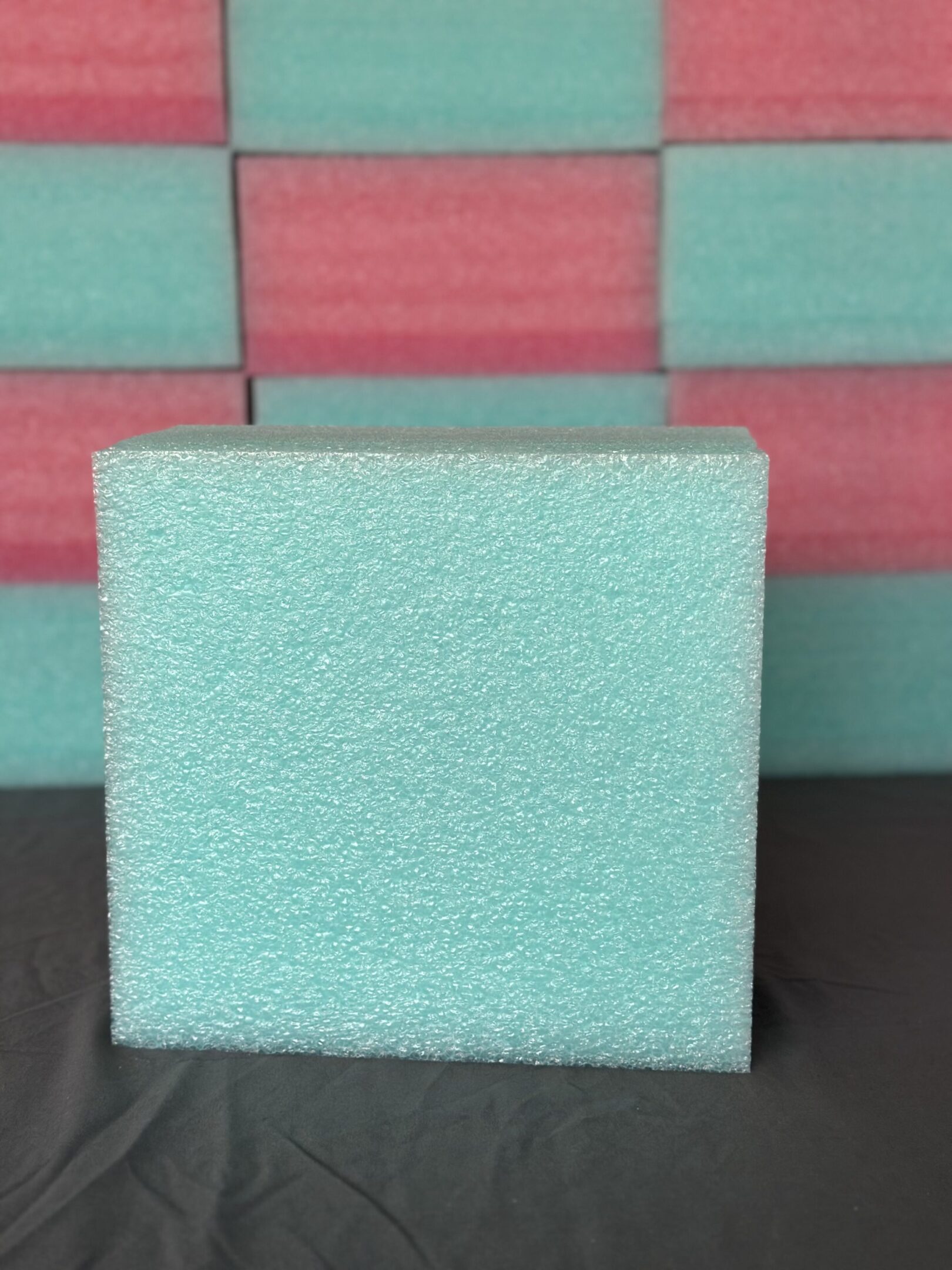 A light blue foam block with a rough texture.