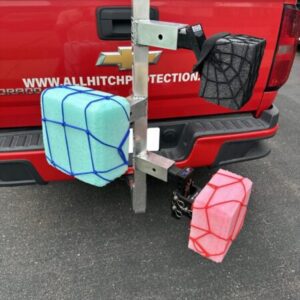 Two gas cans secured to a vehicle hitch-mounted carrier.