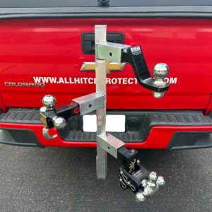 Multi-ball hitch adapter on red Chevy tailgate